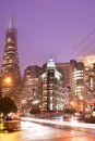 Columbus Avenue with Sentinel building and Transamerica Pyramid Buildingat in a rainy day at night