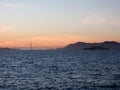 San Francisco city skyline, Golden Gate Bridge, and Alcatraz Island at dusk Royalty Free Stock Photo