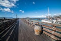 San Francisco city wooden ocean pier with tourist yachts against blue sky. Travel destinations concept