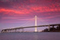 San Francisco - Oakland Bay Bridge under the purple-shaded sunset sky Royalty Free Stock Photo