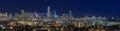 San Francisco skyline night panorama with city lights, the Bay Bridge and light trails on the highway Royalty Free Stock Photo