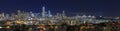 San Francisco skyline night panorama with city lights, the Bay Bridge and light trails on the highway Royalty Free Stock Photo