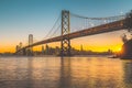 San Francisco skyline with Oakland Bay Bridge at sunset, California, USA Royalty Free Stock Photo