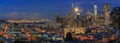 San Francisco skyline panorama at dusk with Bay Bridge and downtown skyline under a full moon Royalty Free Stock Photo