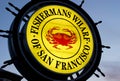 Illuminated yellow circular Logo of famous Fishermans Wharf in San Francisco, California