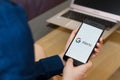 SAN FRANCISCO, US - 22 April 2019: Close up to female hands holding smartphone using Google Alerts Service application, San