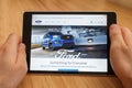 SAN FRANCISCO, US - 1 April 2019: Close up to hands holding tablet using internet and looking through Ford web site, in San Royalty Free Stock Photo