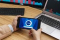 SAN FRANCISCO, US - 18 June 2019: Female Trader Hands Holding the Smartphone Using Application of liquid Cryptocurrency Exchange