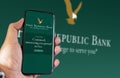 Hand holding a phone with the First Republic Bank logo on the screen