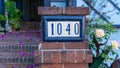 House number 1040 made of ceramic tiles on a brick wall Royalty Free Stock Photo