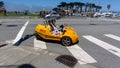 Tourists in small yellow rental cars from GoCar