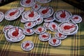 Pins with the American Indian Movement symbol at a powwow in San Francisco