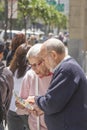 Elderly tourist couple studies the town map to find the way downtown San Francisco