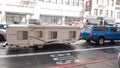 San Francisco, USA - May 19, 2019: blue pickup truck car towing trailmanor 2720 travel trailer