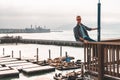 Young man sitting in San Francisco with an amazing downtown view near the pier 39 Royalty Free Stock Photo