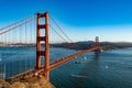 San Francisco, USA - November 2017: Golden Gate Bridge and a big barge floats under it. Royalty Free Stock Photo