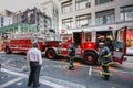 Fire truck and firemen work on the street