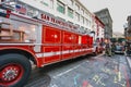 Fire truck and firemen work on the street