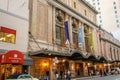 Unidentified people enter Geary Theater in the Theatre District