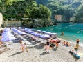 San Fruttuoso abbey, Italy - September 17, 2019: The people at beach near San Fruttuoso abbey Royalty Free Stock Photo