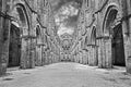 San Galgano abbey in Chiusdino, Siena, Tuscany, Italy. Roofless nave with colonnade of the medieval Gothic style church