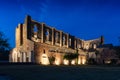 The San Galgano roofless abbey illuminated at sunset in summer