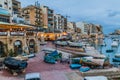 SAN GILJAN, MALTA - NOVEMBER 11, 2017: Boats on the waterfront of San Giljan at Spinola Bay in Mal Royalty Free Stock Photo