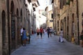 SAN GIMIGNANO, ITALY - 14 AUGUST 2014, Tourists tours in the one of the oldest city of italy Royalty Free Stock Photo