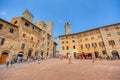 Panoramic view of famous Piazza della Cisterna in the historic town of San Gimignano on a sunny day, Tuscany, Italy Royalty Free Stock Photo