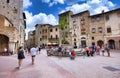 Panoramic view of famous Piazza della Cisterna in the historic town of San Gimignano on a sunny day, Tuscany, Italy Royalty Free Stock Photo