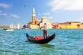 San Giorgio Maggiore Island of Venice and a traditional gondolier in his gondola