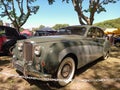 Old 1958 Jaguar MK 8 luxury sedan under the trees. Sunny day. Autoclasica 2022 classic car show.