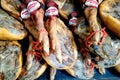 San Javier, Spain - July 29 2018: Whole cured ham legs for sale in a Spanish supermarket