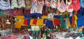 San Jose Succotz, Cayo, Belize - June 18, 2022: Multi-colored masks at Central American vendor stalls selling wares adjacent to