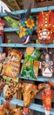 San Jose Succotz, Cayo, Belize - June 18, 2022: Multi-colored masks at Central American vendor stalls selling wares adjacent to