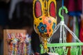 San Jose Succotz, Cayo, Belize - June 18, 2022: Multi-colored masks at Central American vendor stalls selling wares adjacent to