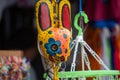 San Jose Succotz, Cayo, Belize - June 18, 2022: Multi-colored masks at Central American vendor stalls selling wares adjacent to