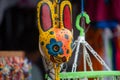 San Jose Succotz, Cayo, Belize - June 18, 2022: Multi-colored masks at Central American vendor stalls selling wares adjacent to