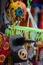 San Jose Succotz, Cayo, Belize - June 18, 2022: Multi-colored masks at Central American vendor stalls selling wares adjacent to