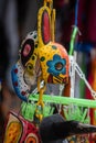 San Jose Succotz, Cayo, Belize - June 18, 2022: Multi-colored masks at Central American vendor stalls selling wares adjacent to