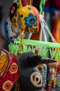 Multi-colored masks at Central American vendor stalls selling wares adjacent to