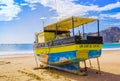 San Juan del Sur, Nicaragua - May 11, 2018: Outdoor view of yellow boat on the beach of San Juan Del sur on the ocean