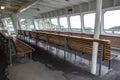 San Juan Island, WA USA - circa November 2021: Angled view of bench seating inside of a Washington State Ferry bound for Friday