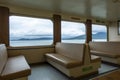 San Juan Island, WA USA - circa November 2021: Angled view of padded bench seating inside of a Washington State Ferry bound for Royalty Free Stock Photo