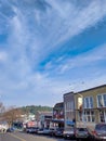 View from uphill of downtown Friday Harbor, crows flying across a bright blue sky