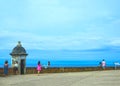 San Juan, Puerto Rico - May 08, 2016: The people making photos at large outer wall with sentry box of fort San Cristobal Royalty Free Stock Photo