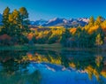 San Juan Range and fall color reflects in Colorado pond Royalty Free Stock Photo