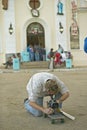 San Lazaro Catholic Church and cameraman on skateboard in El Rincon, Cuba