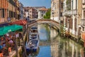 San Lorenzo channel with bridge and pizzeria, Venice