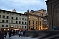 San Lorenzo square. with a corner of the church of the same name and the shops with the lights on, in the evening in Florence. Royalty Free Stock Photo